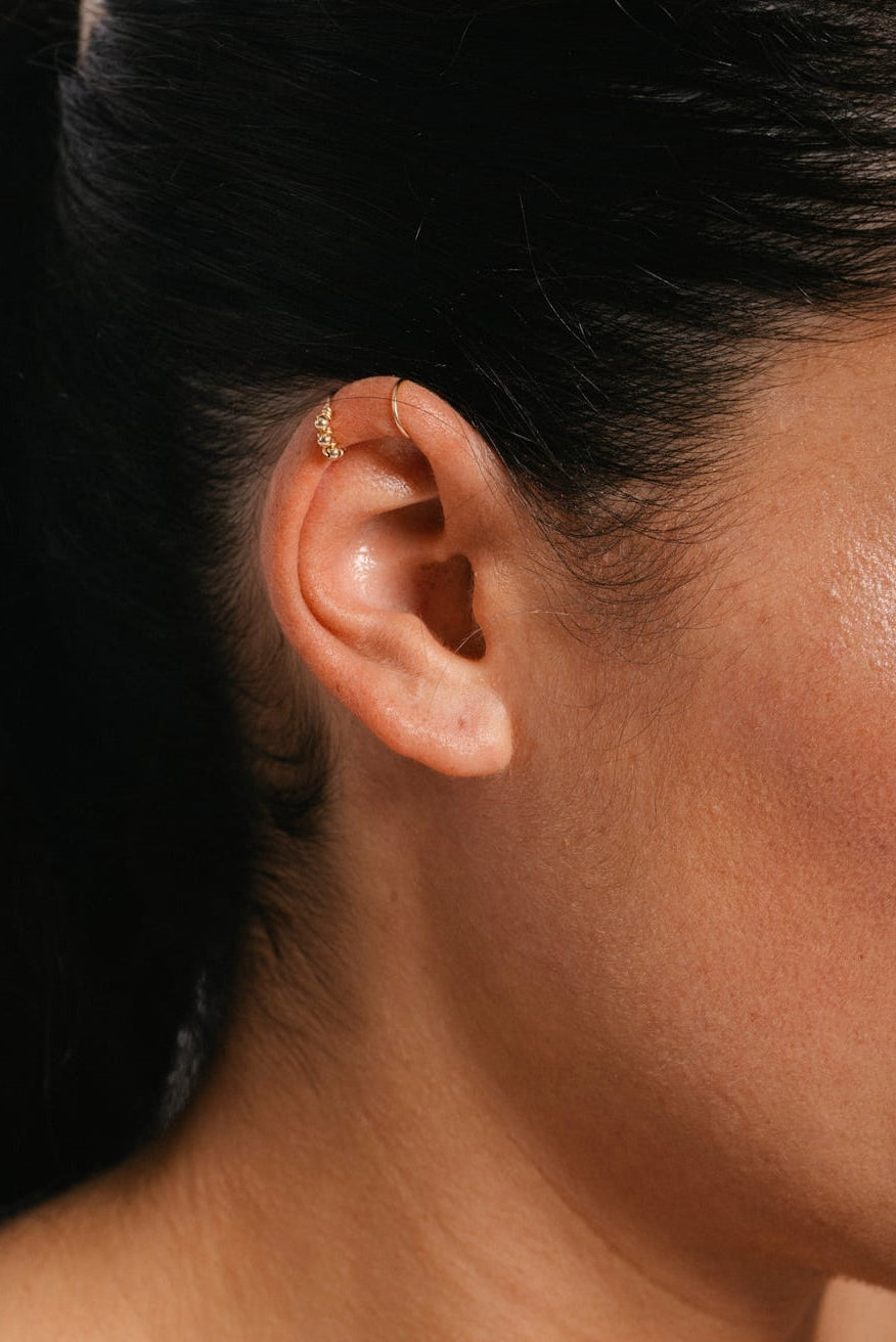 Woven double helix faux piercing